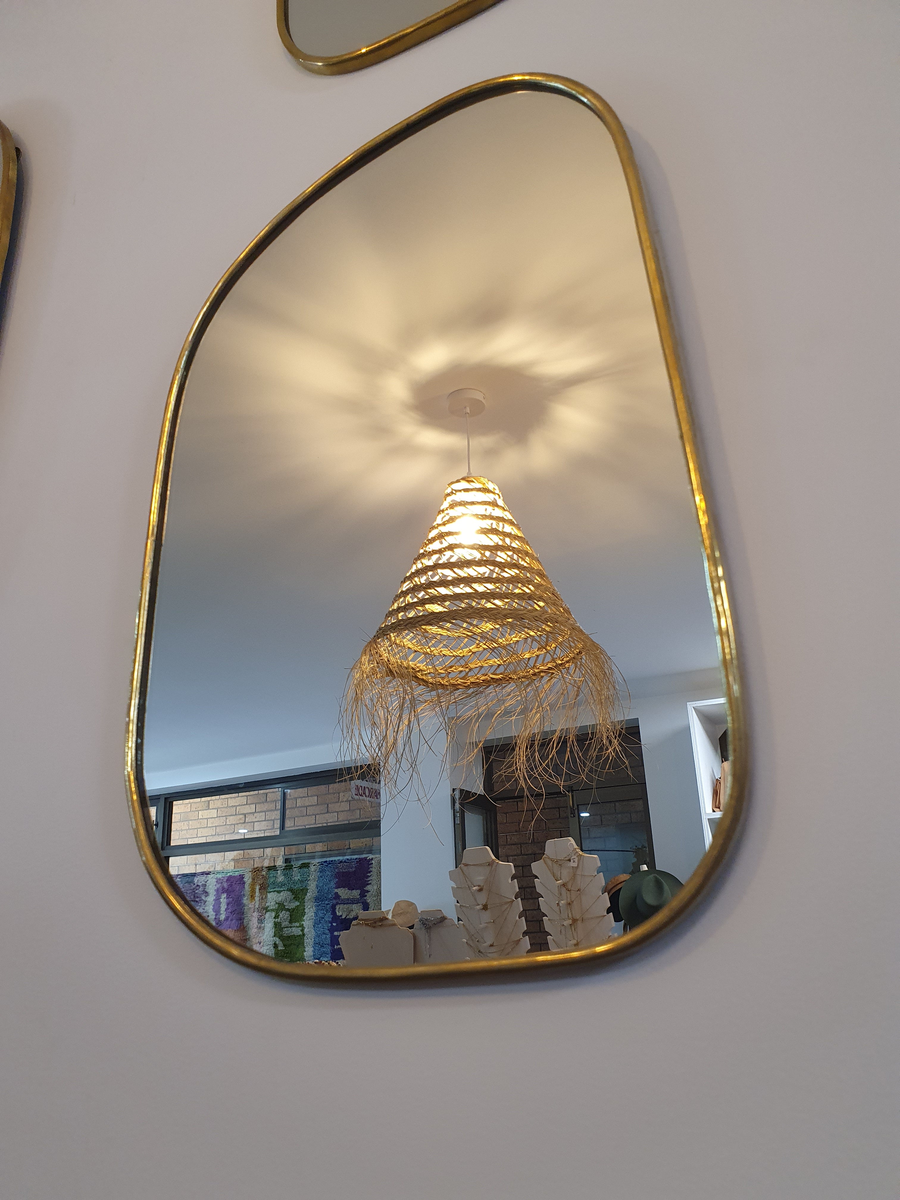 oblong shaped, brass lined decorative mirror